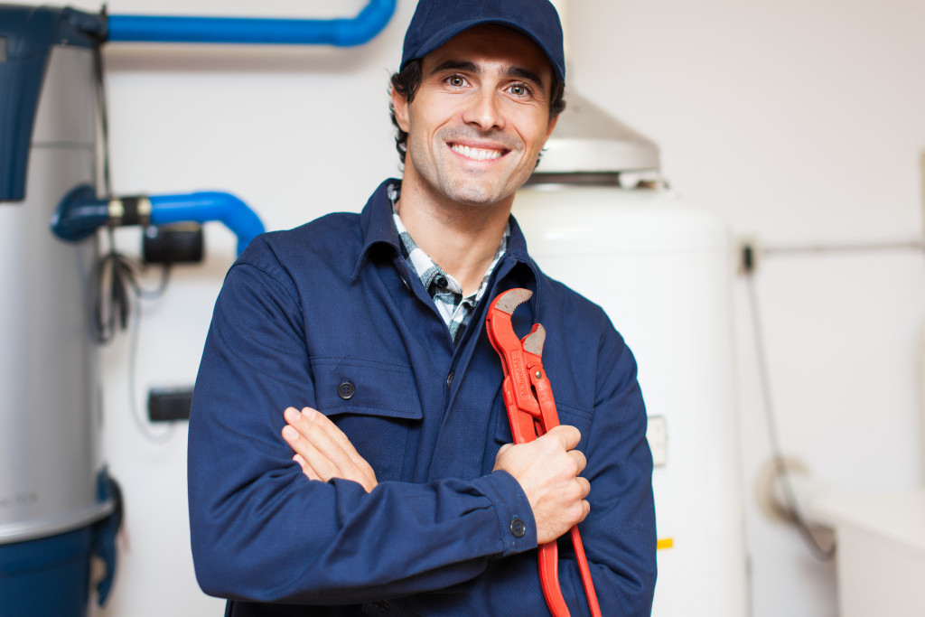 a repairman with tool in his PPE